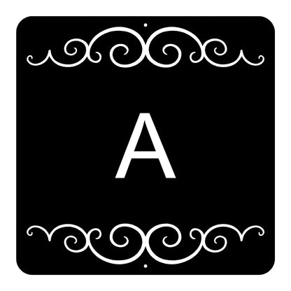 Black square with white decorative border and letter 'A'