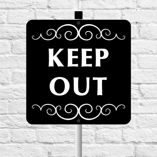 Black sign with 'KEEP OUT' text on a white brick wall background