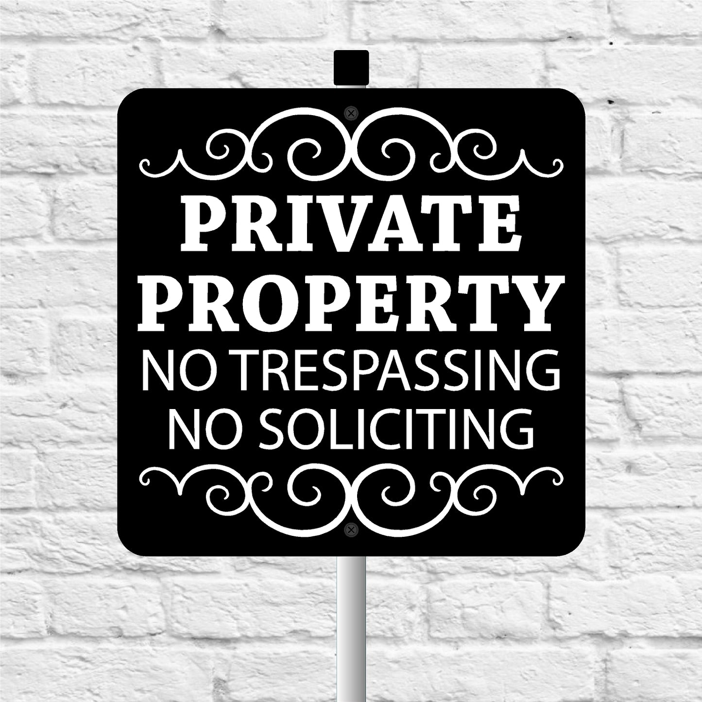 Black and white 'Private Property No Trespassing No Soliciting' sign on a white brick background