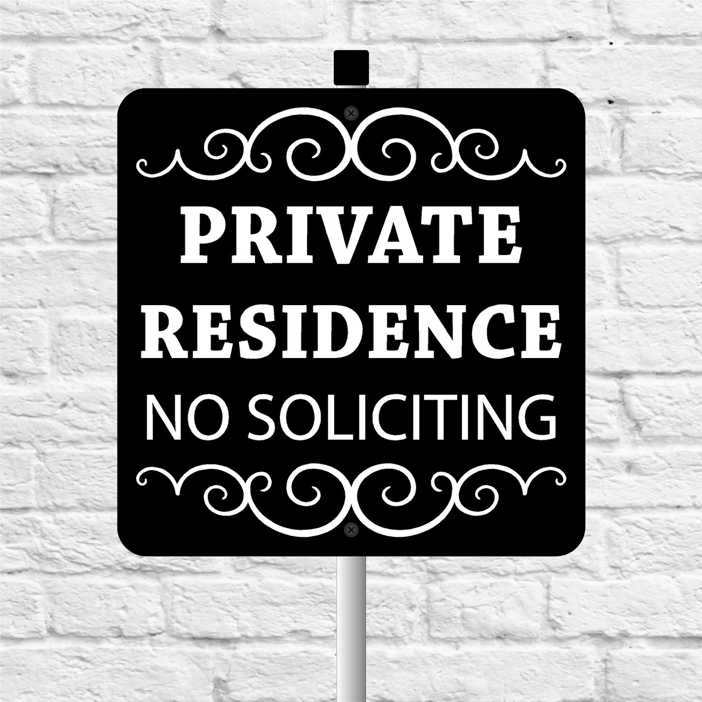 Black sign with 'Private Residence No Soliciting' text on a white brick wall background
