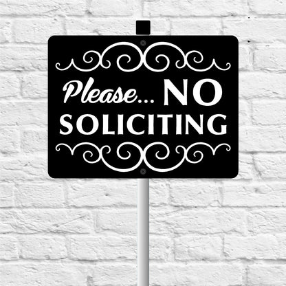 No soliciting sign with decorative elements on a white brick wall background