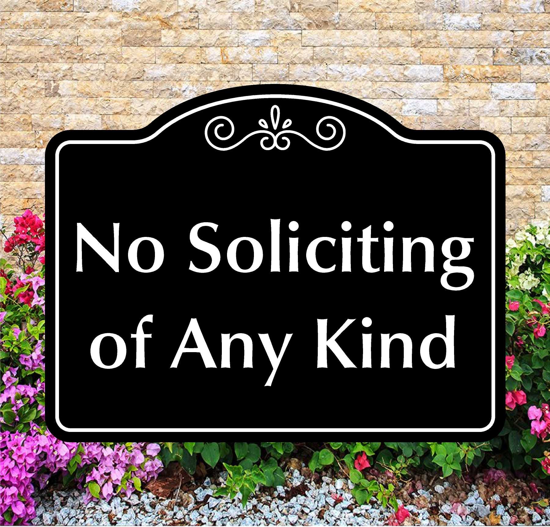 Decorative sign with 'No Soliciting of Any Kind' text in front of a stone wall and flowers.