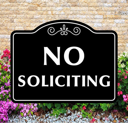 No Soliciting sign with decorative border on a stone wall background