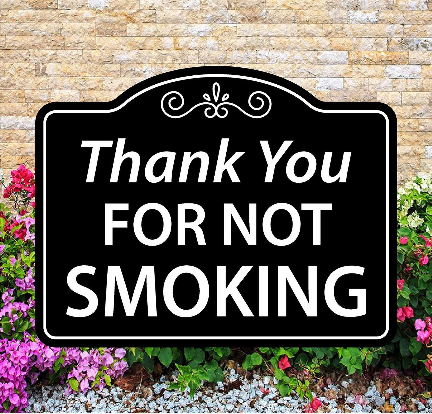 Decorative sign with 'Thank You FOR NOT SMOKING' text against a brick wall and floral background
