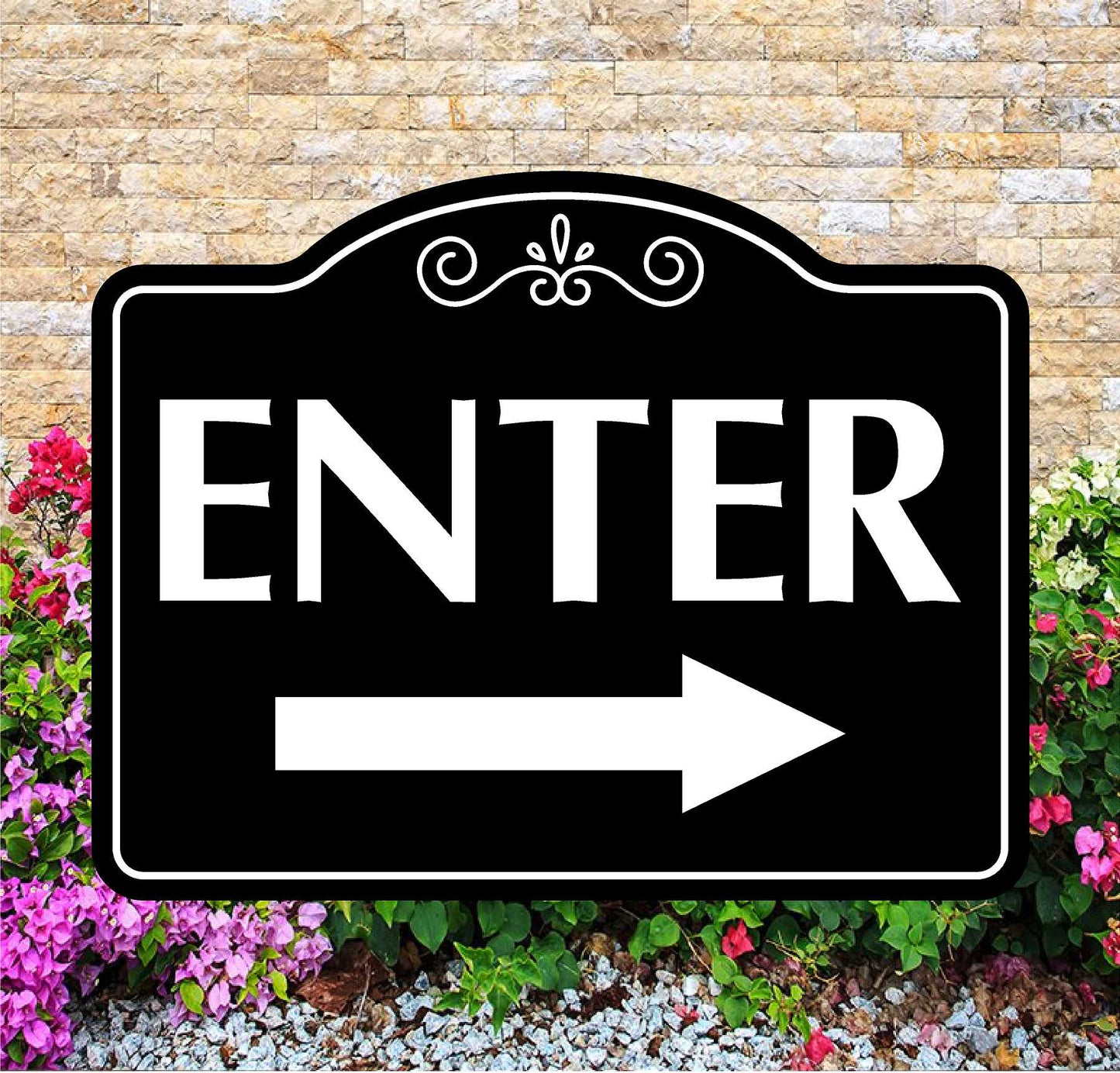 Decorative 'Enter' sign with an arrow on a stone wall background