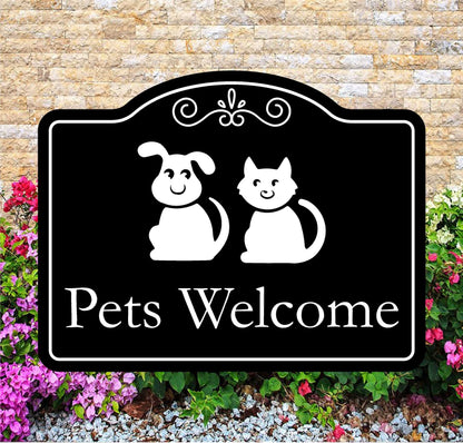 Decorative sign with a dog and cat illustration and 'Pets Welcome' text, set against a brick wall and floral background.