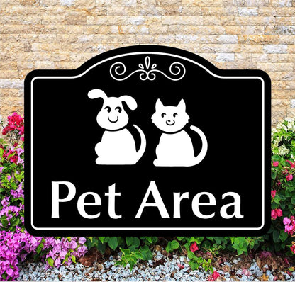 Decorative sign with a dog and cat illustration and 'Pet Area' text, set against a brick wall and floral background.