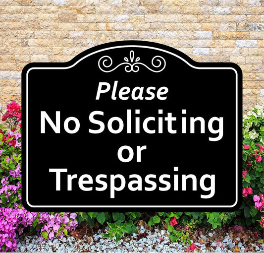 No Soliciting or Trespassing sign with decorative border on a stone wall background
